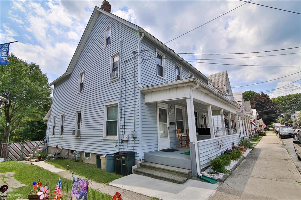 a front view of a house with a porch