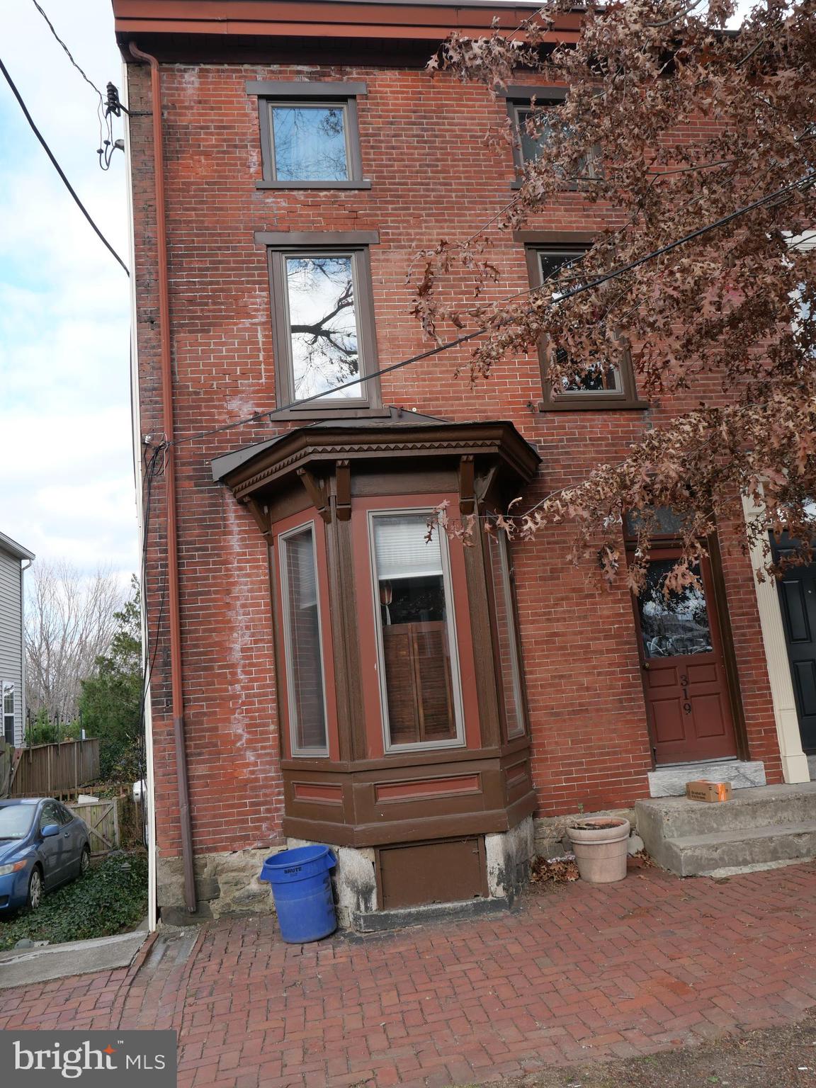 a brick house with a small yard