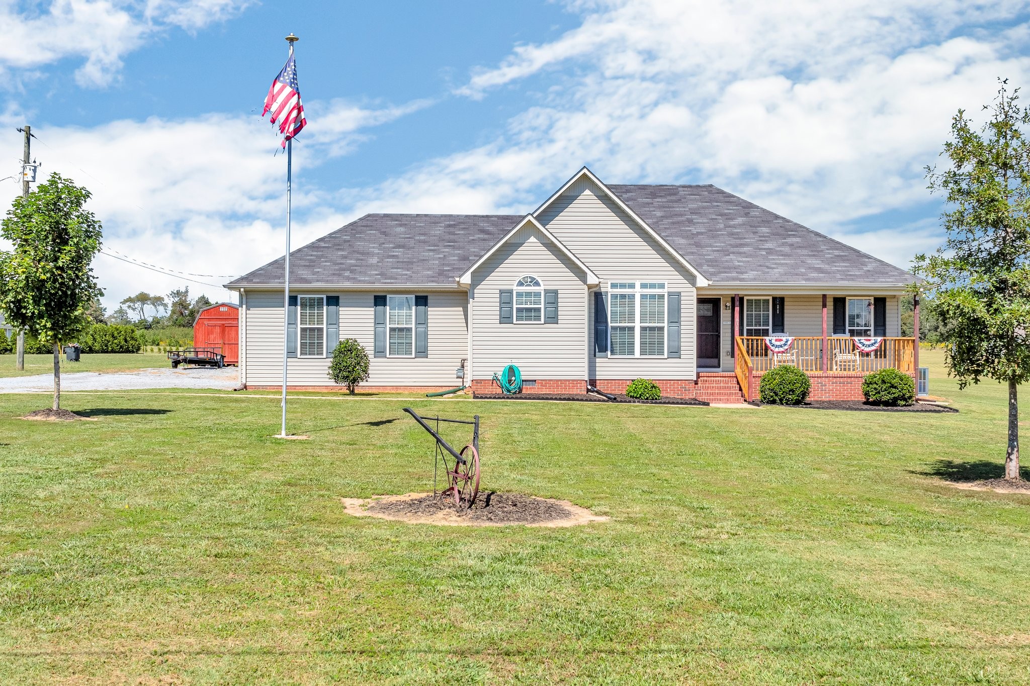 a front view of a house with a yard