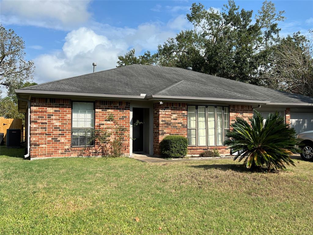 a view of a house with a yard and porch