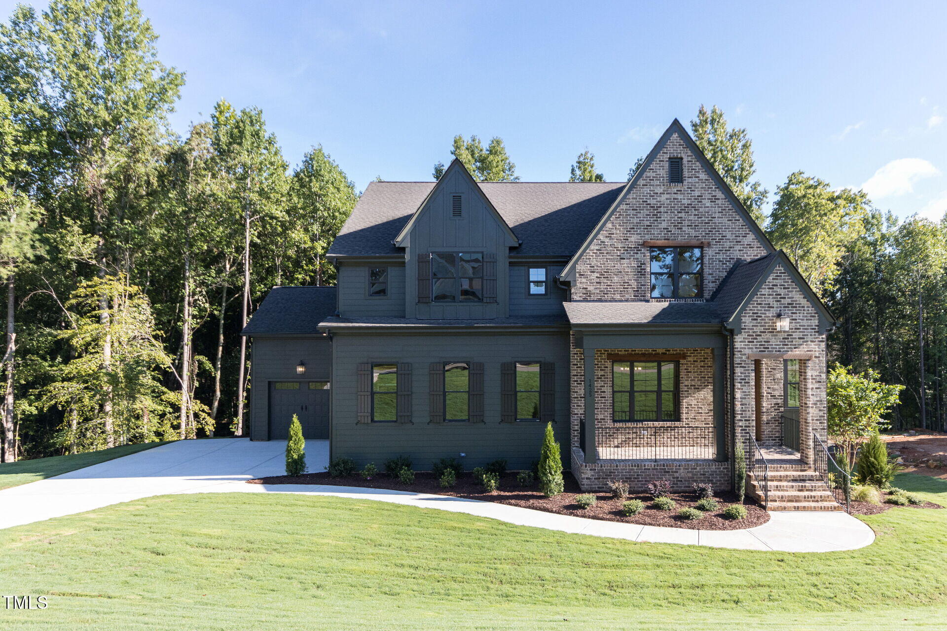 a view of a brick house with a yard