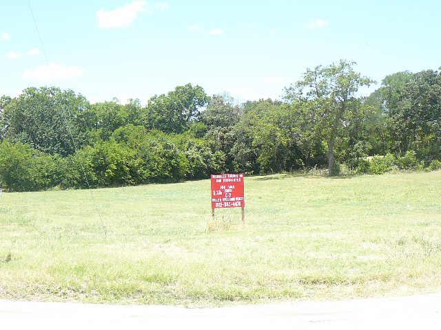 a sign that is on the side of a field