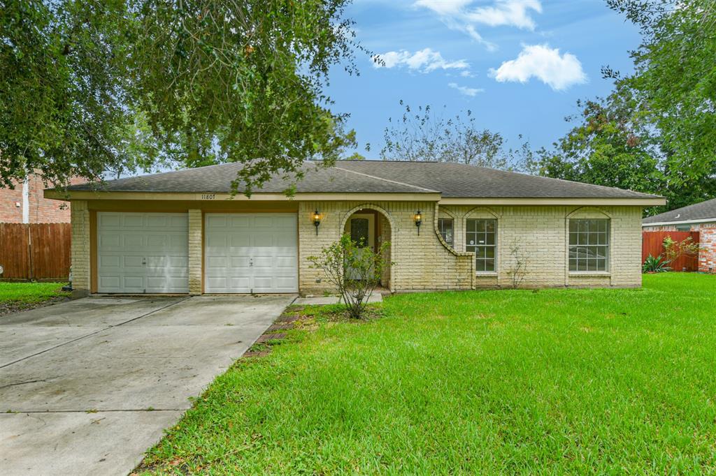 front view of a house with a garden