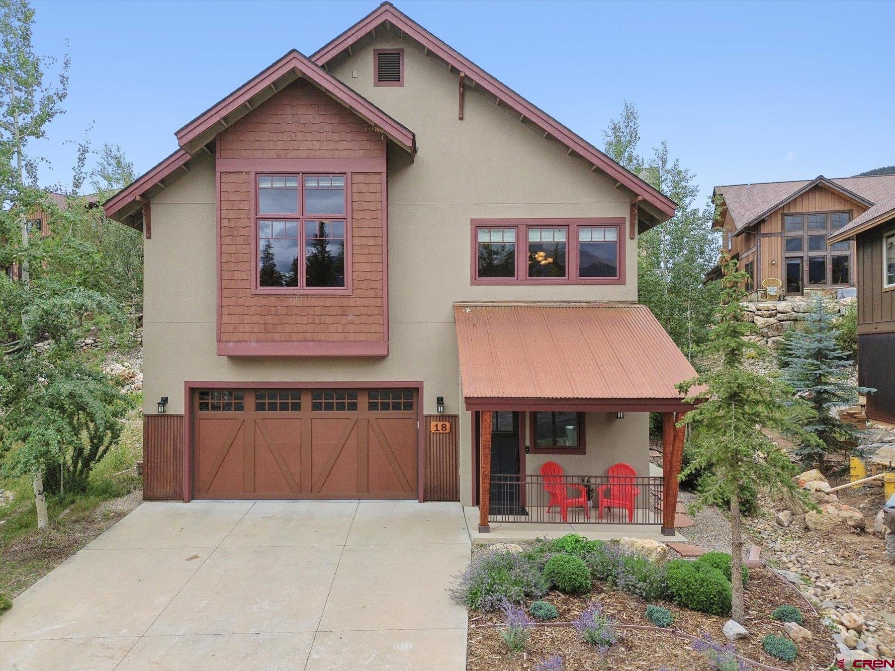 a front view of a house with garage