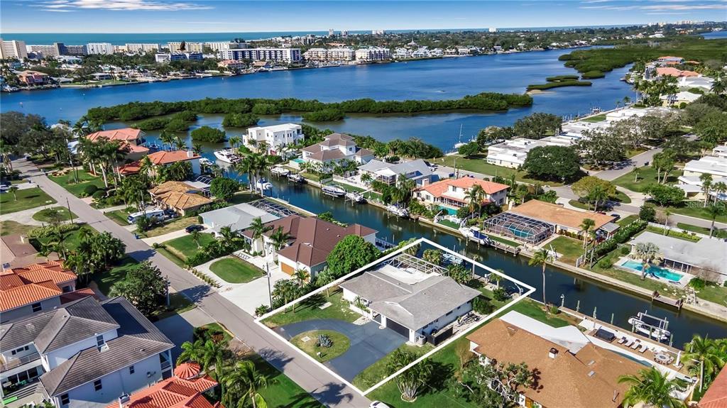 an aerial view of a house with a lake view