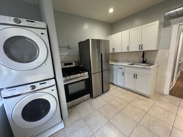 a kitchen with a refrigerator sink and cabinets