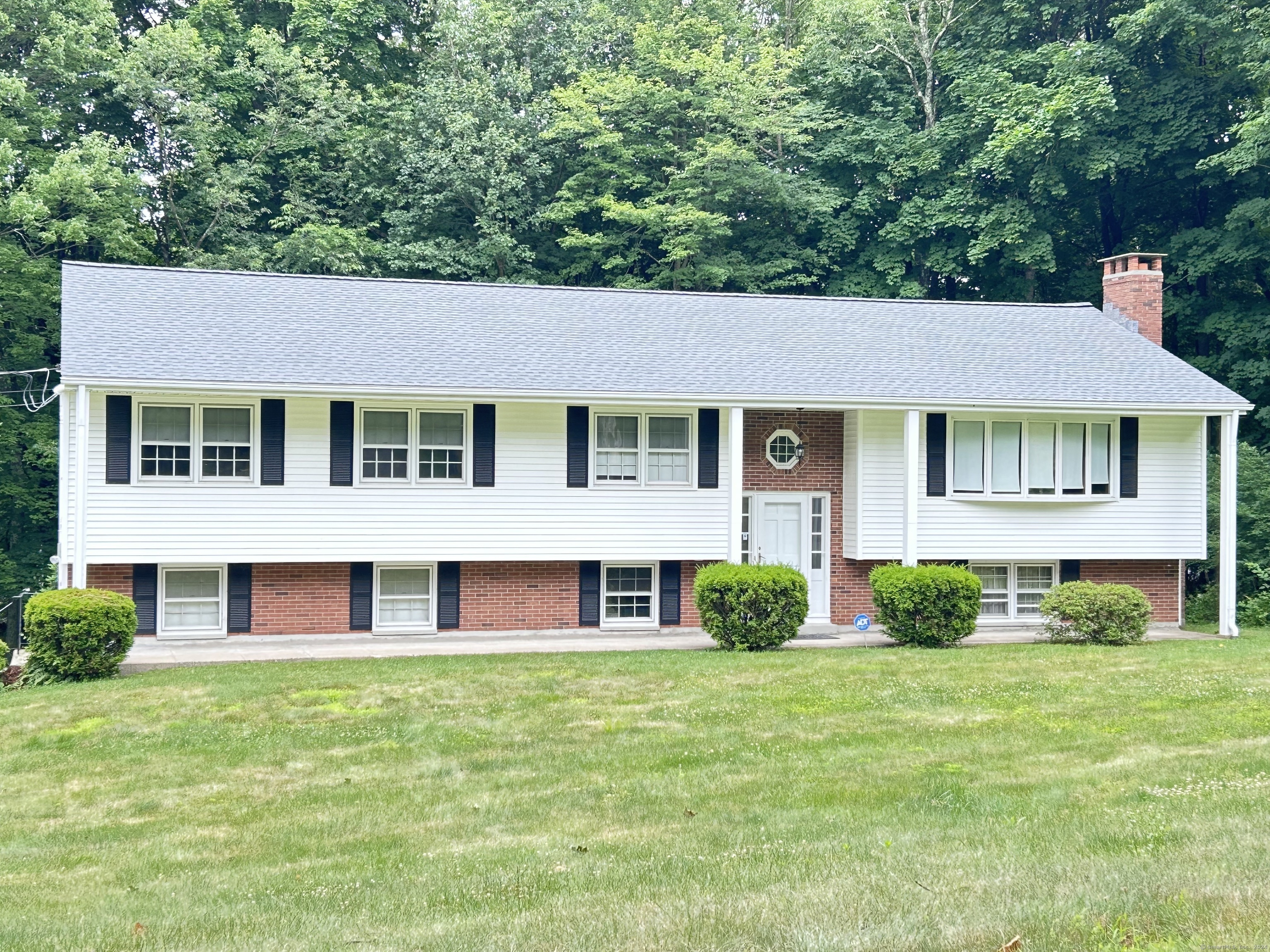 a brick building with a yard