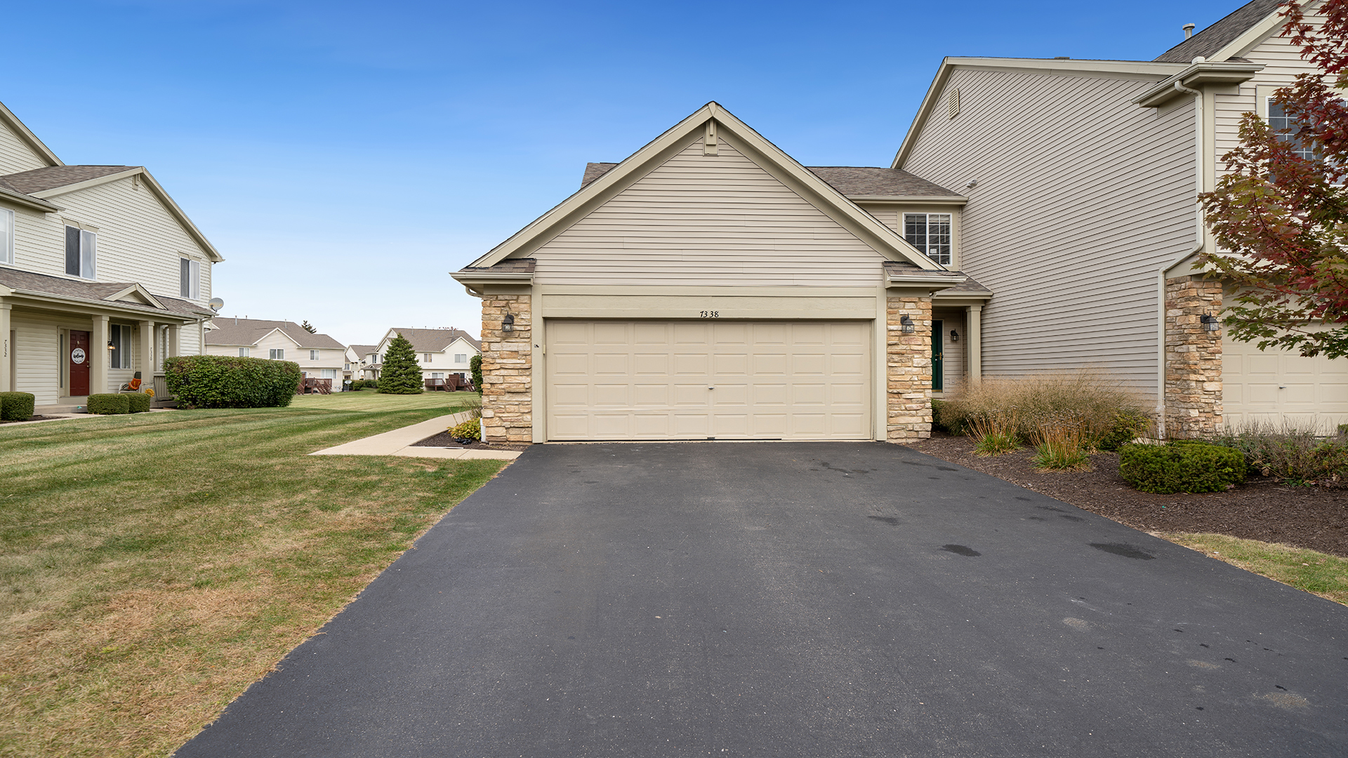 a view of garage and yard