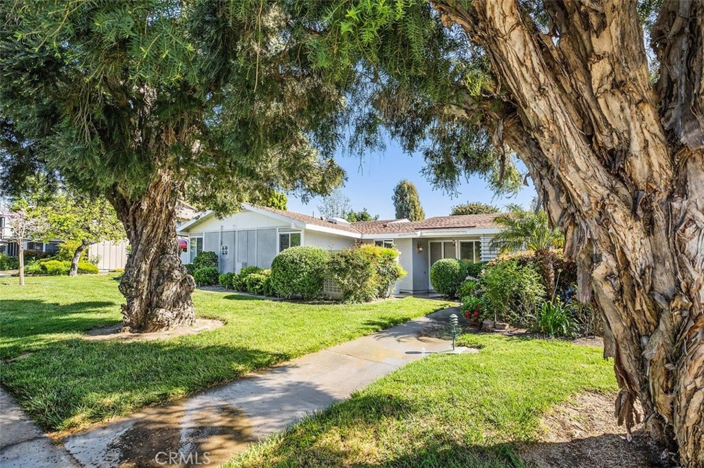 Your serene sanctuary, surrounded by maple and pine trees,  creating a tranquil and serene environment, with a covered carport that is the closest to your door!