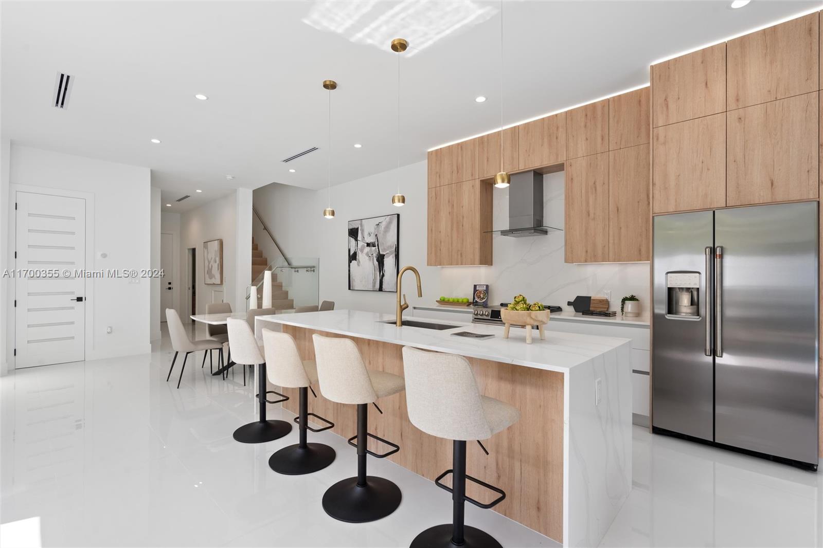 a kitchen with a sink cabinets and stainless steel appliances