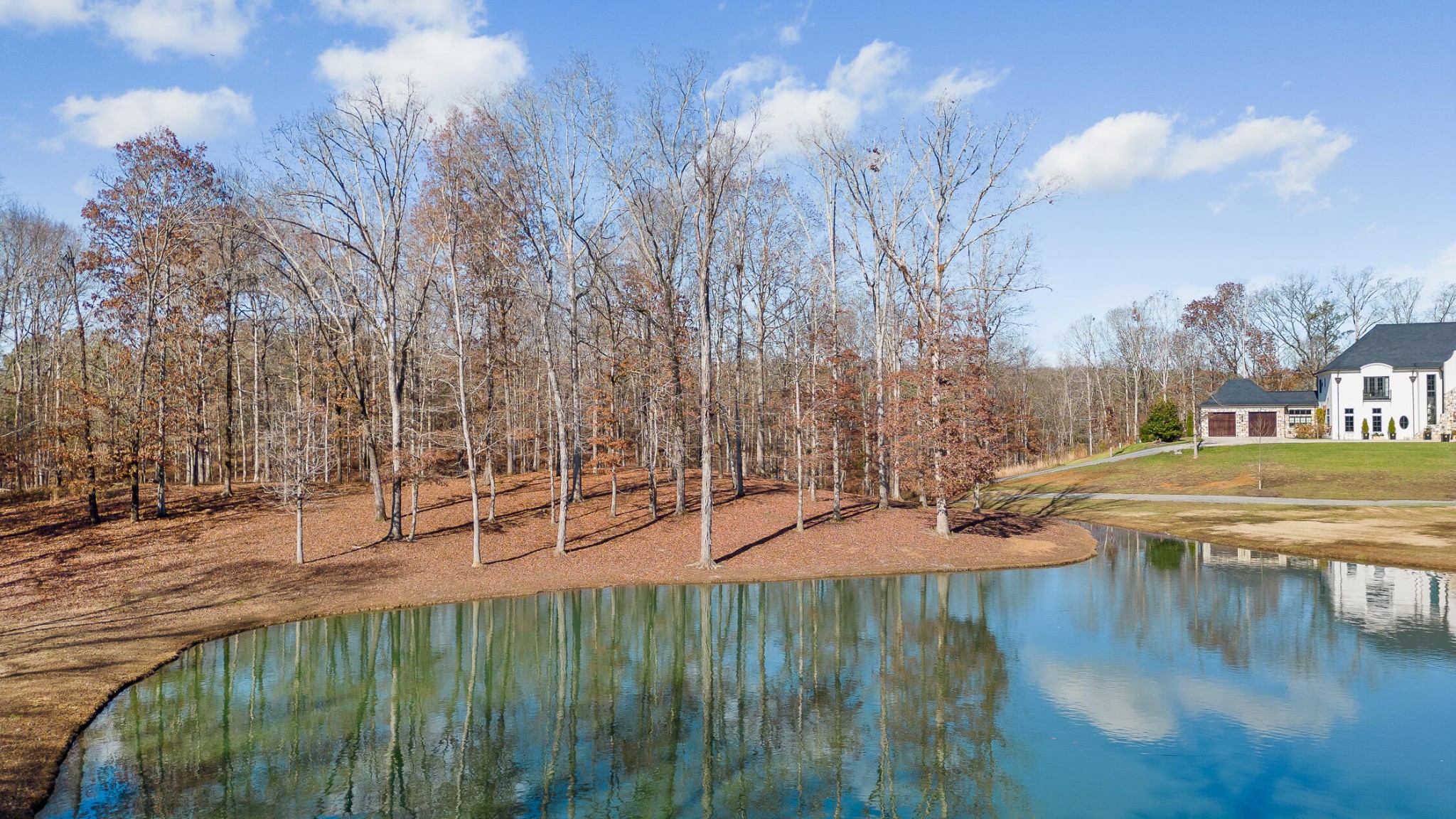 a view of a backyard with swimming pool