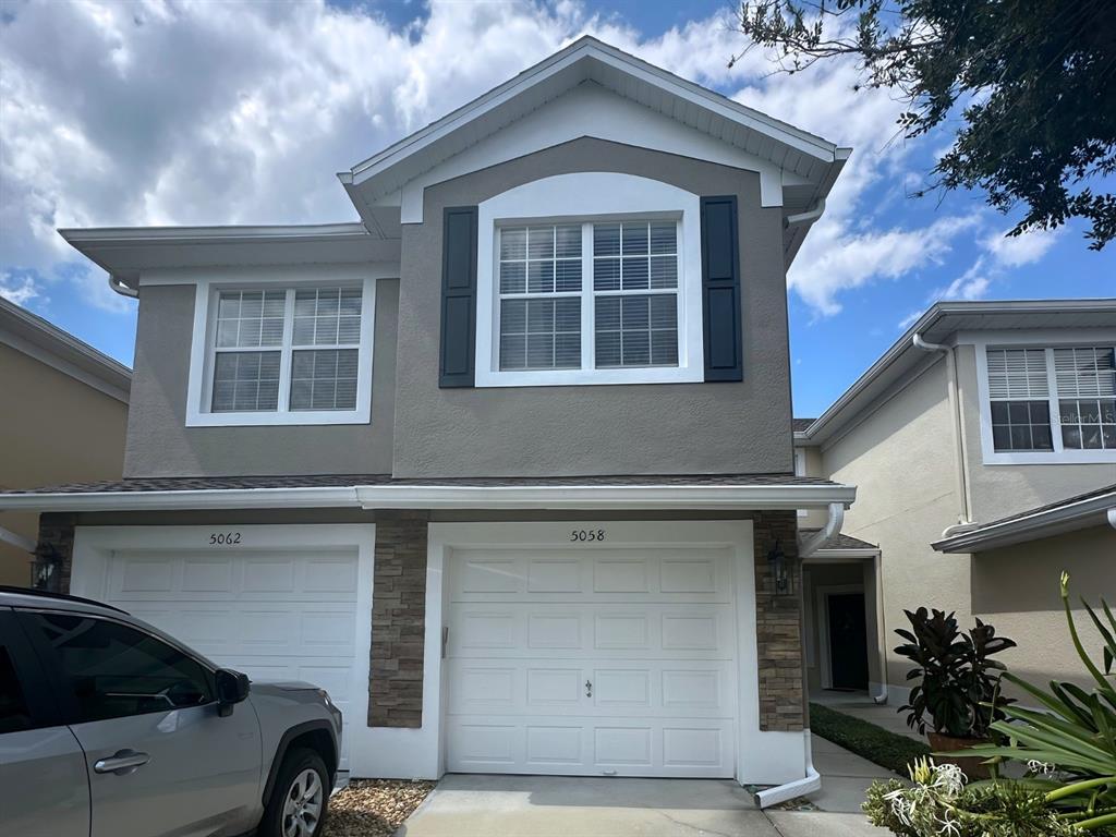 a front view of a house with a garage