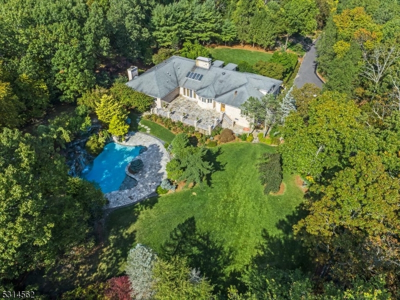 an aerial view of residential house with outdoor space