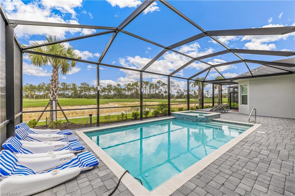 a view of a swimming pool with a patio