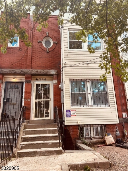 a front view of a house with a porch