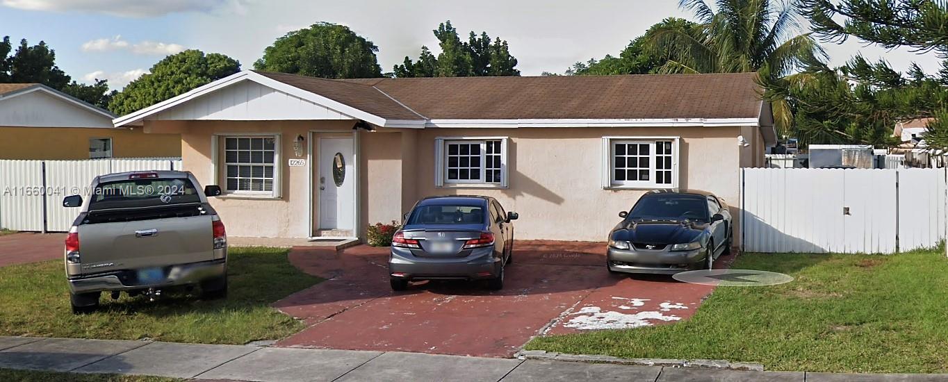 a car parked in front of a house