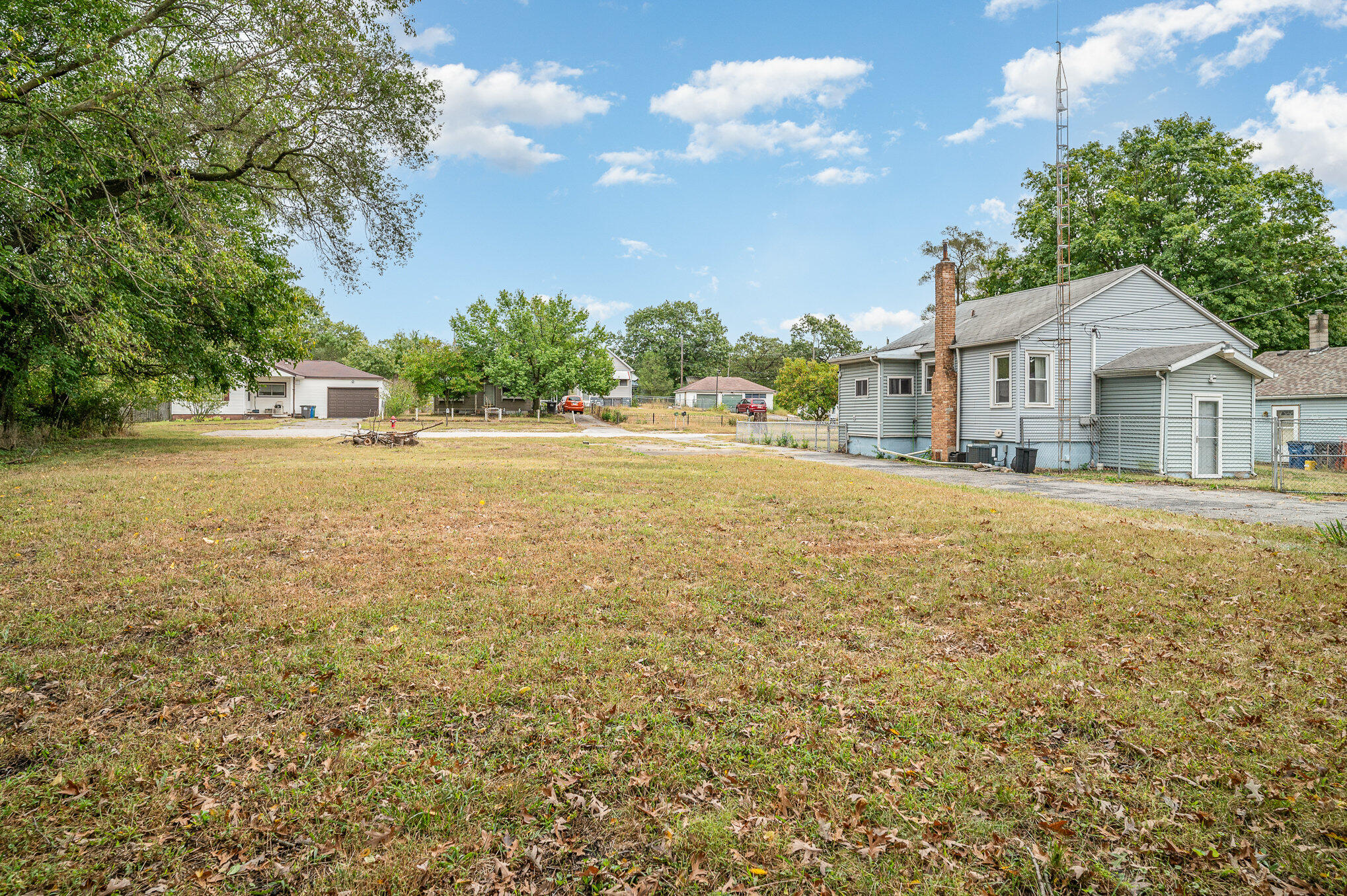 a view of a house with a yard and garage