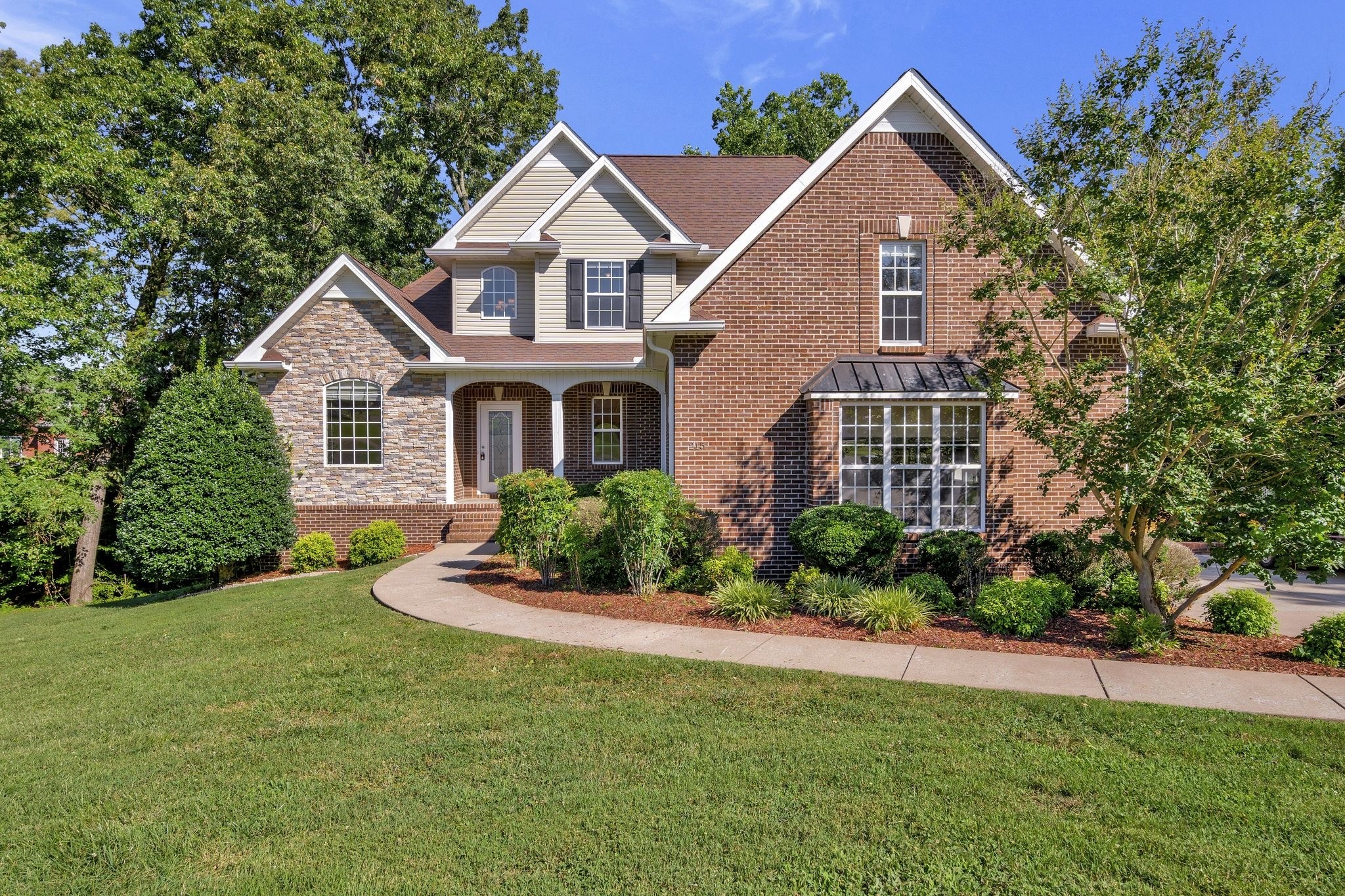 front view of a house with a yard