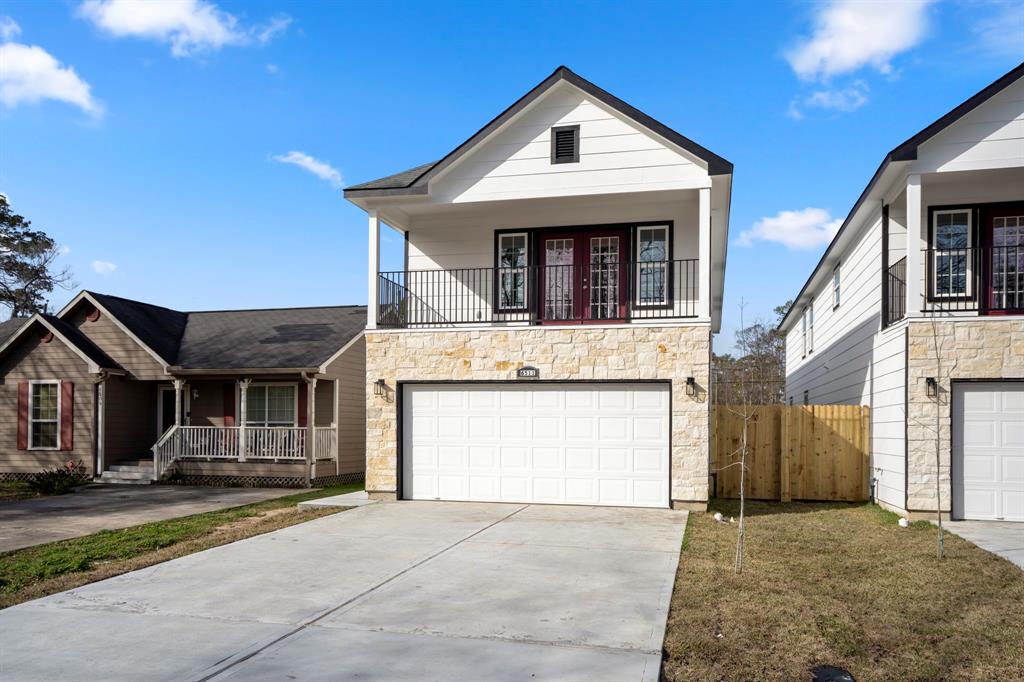 a front view of a house with a garage