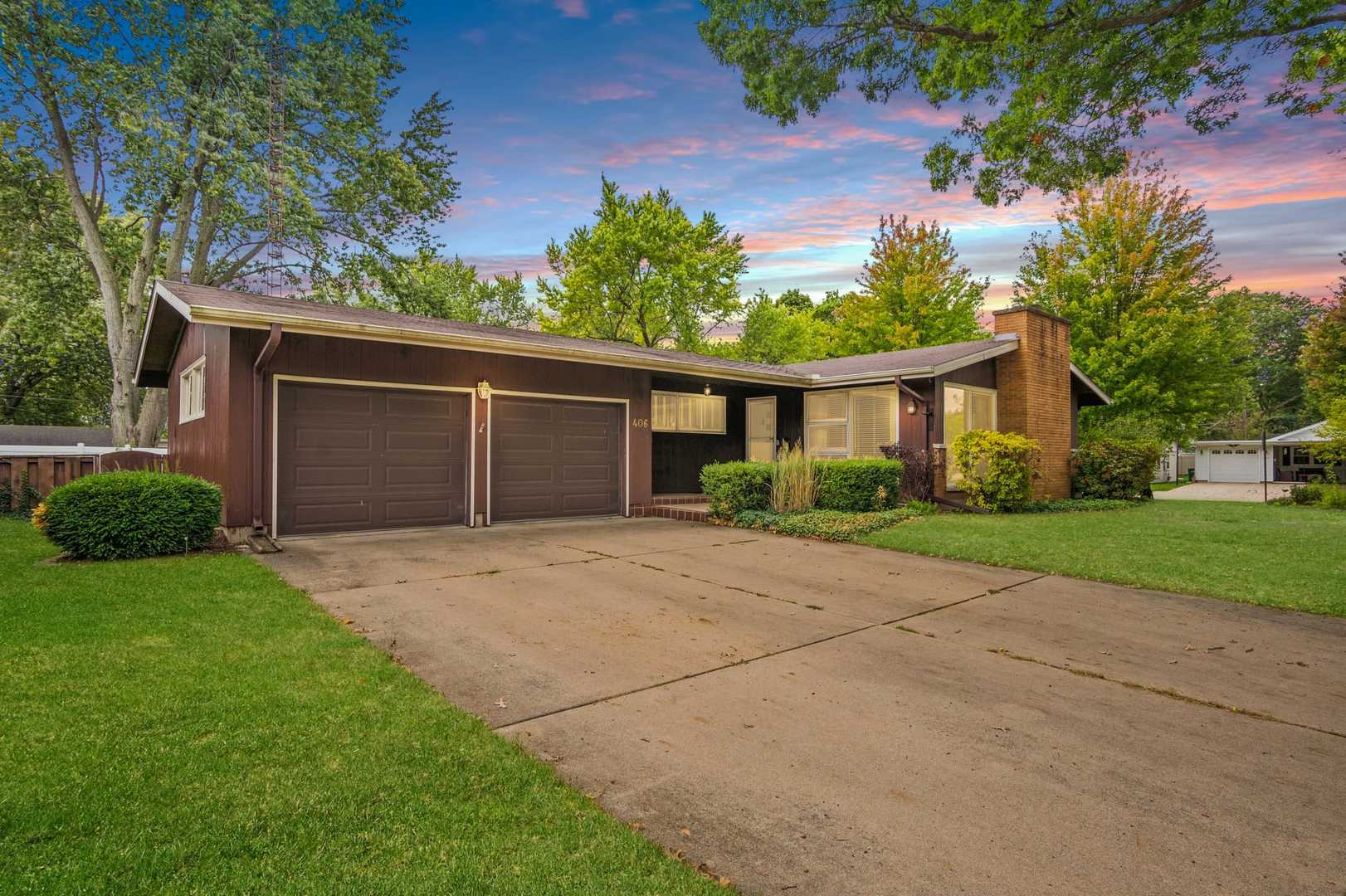 front view of a house with a yard