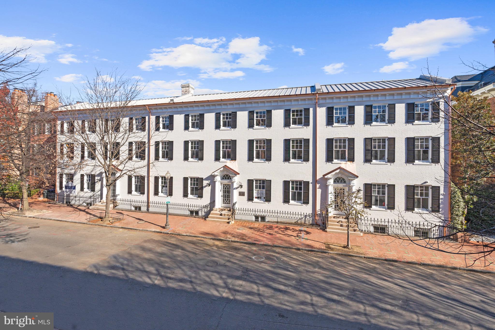 a front view of a building with street view