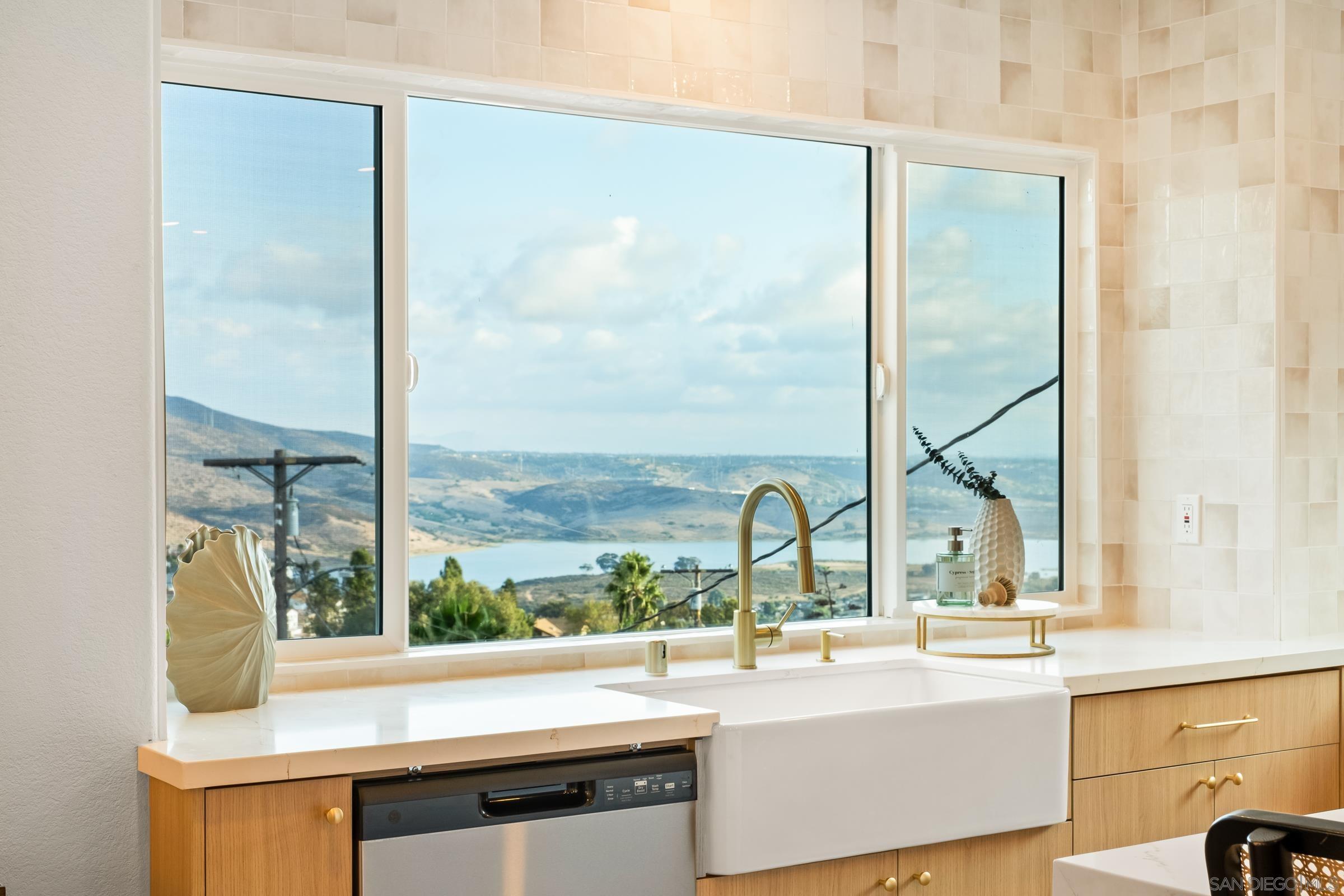 a view of a sink and a window