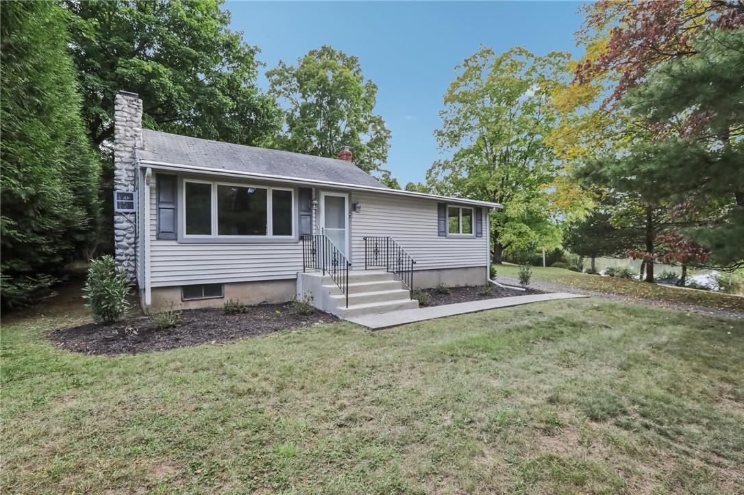 View of front of home featuring a front lawn