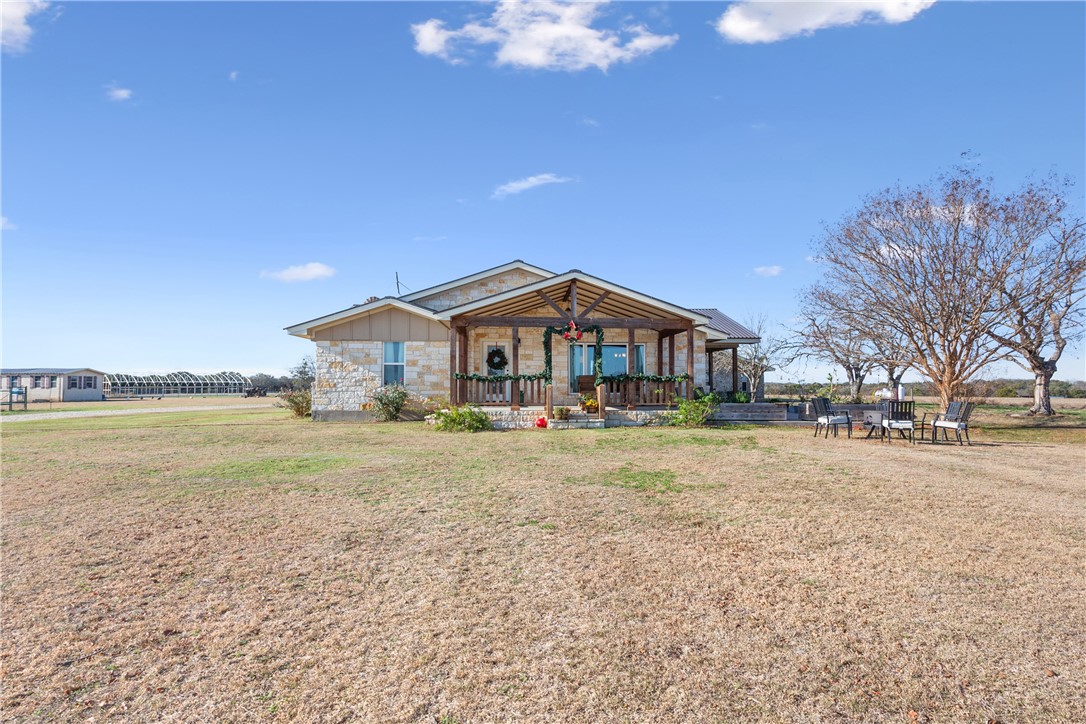 a front view of house with outdoor space and seating