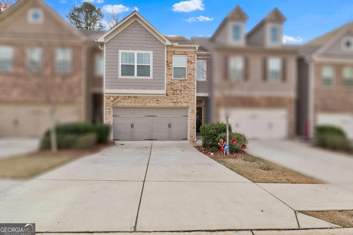 a front view of a house with yard