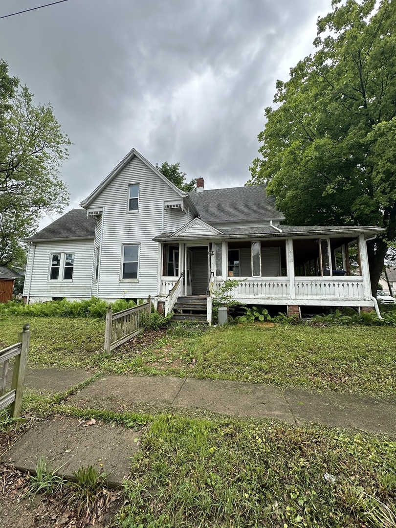 a house with trees in the background