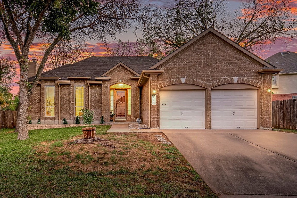 a front view of a house with a yard