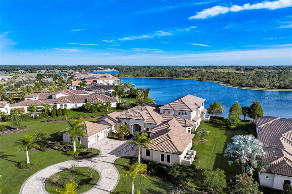 an aerial view of a house with a lake view