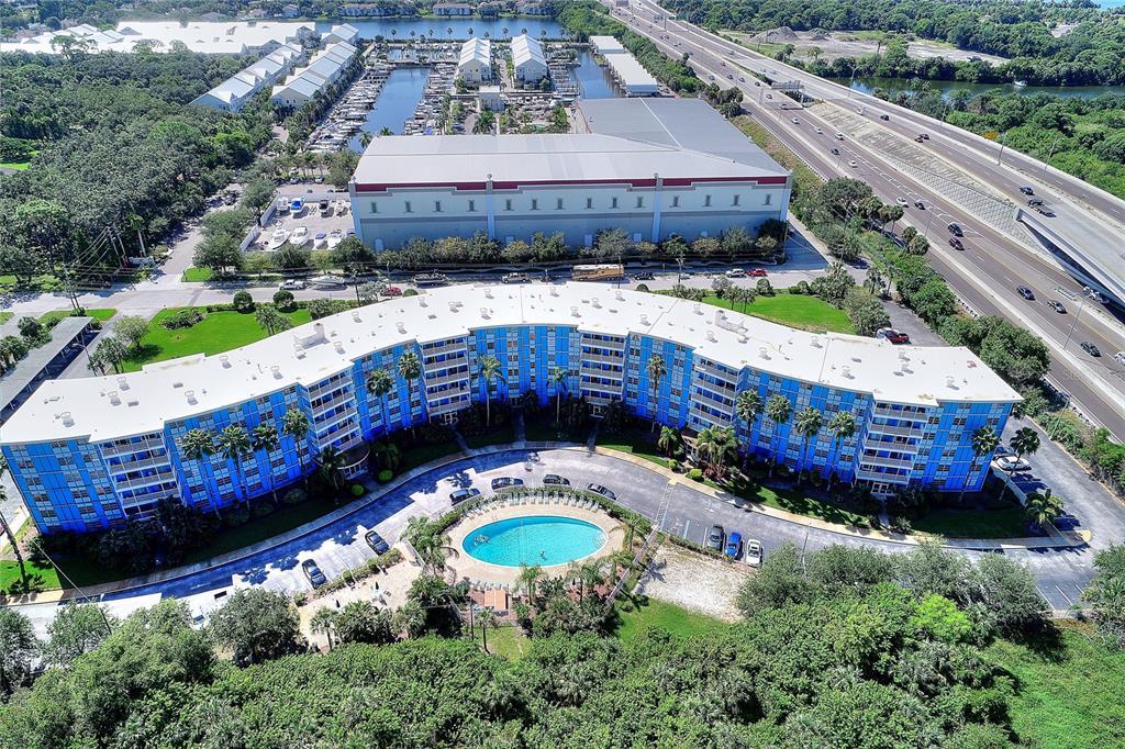 an aerial view of a house with a yard basket ball court and outdoor seating