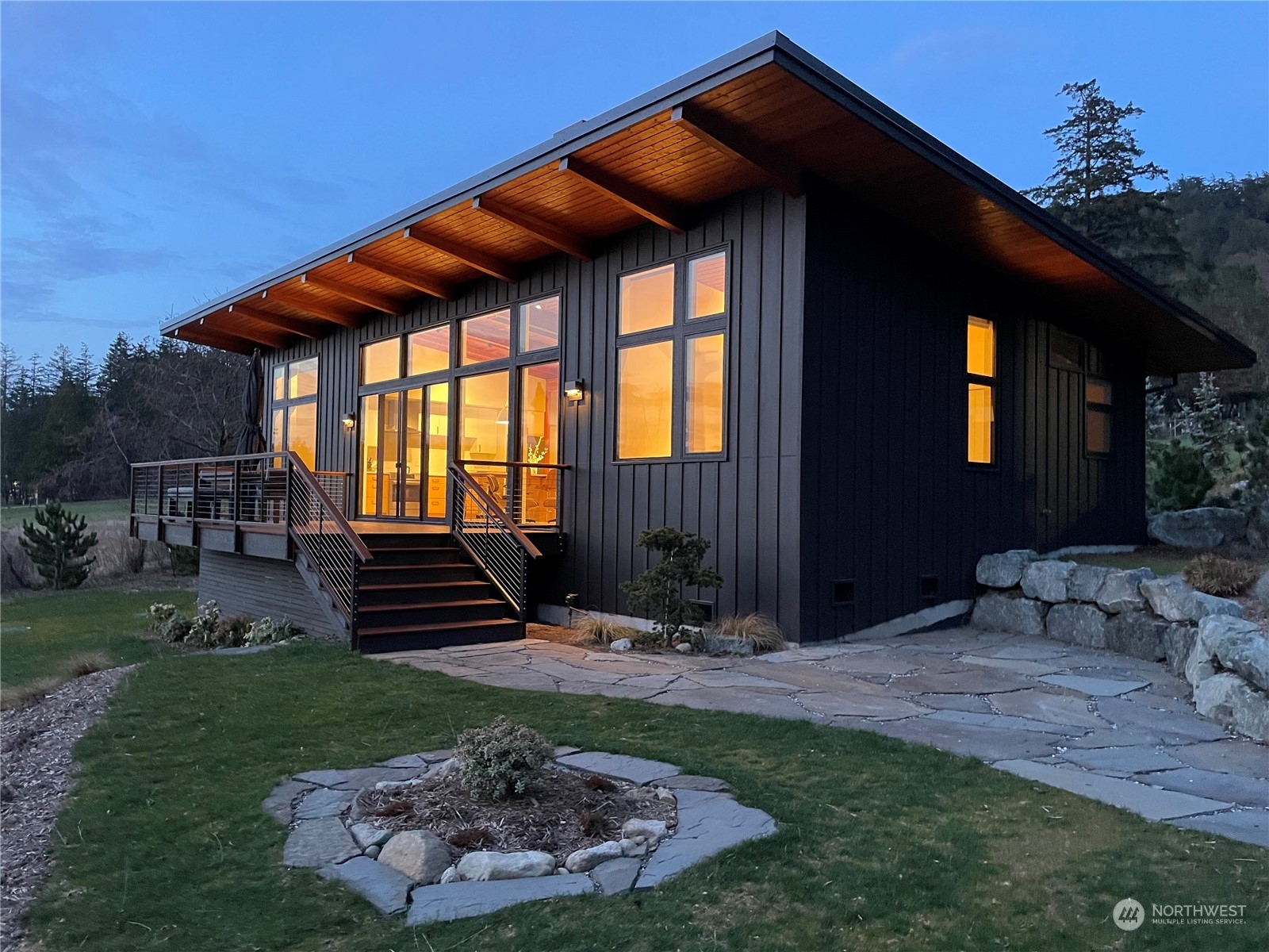 a front view of house with outdoor seating