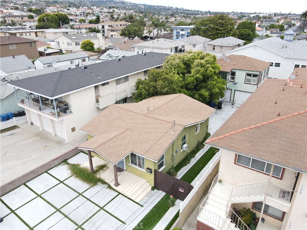 an aerial view of a house with a swimming pool