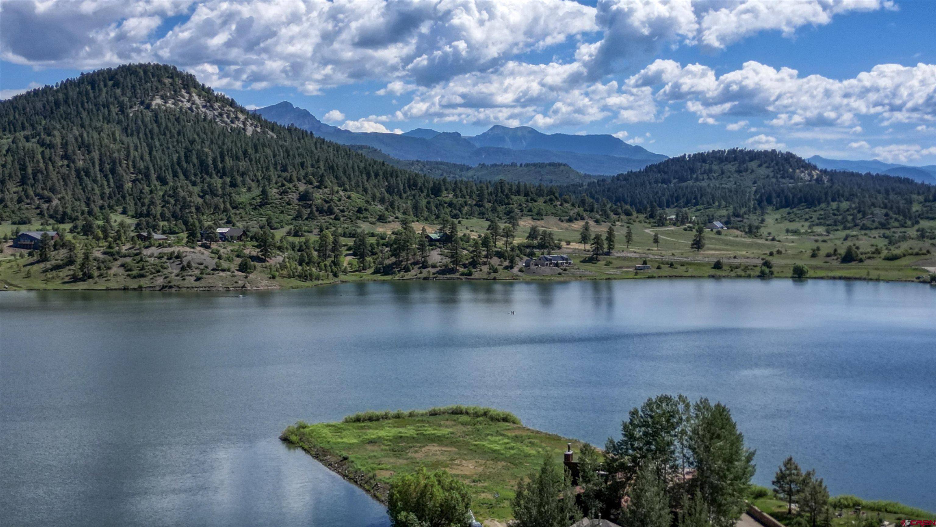 a view of a lake with a mountain in the background