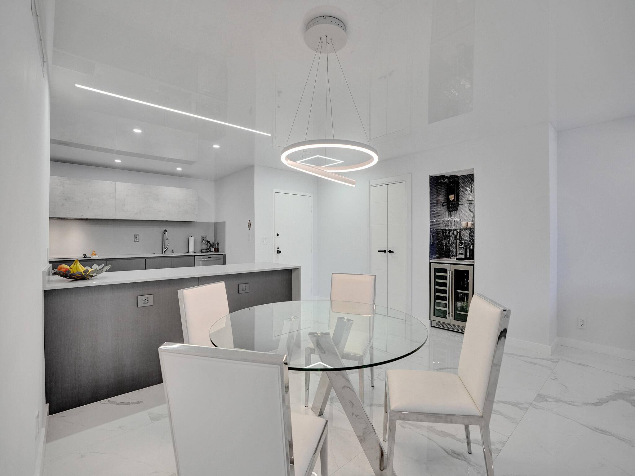 a kitchen with stainless steel appliances granite countertop a sink and a refrigerator