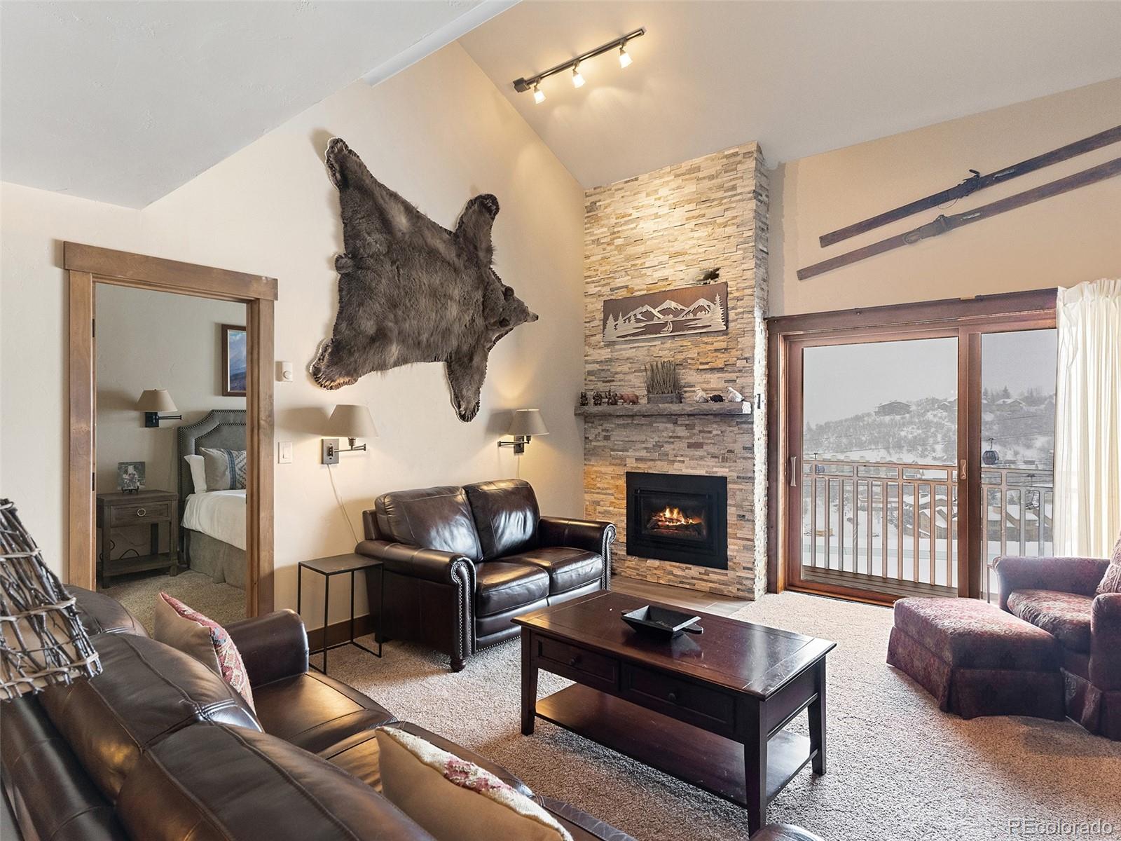 a living room with furniture fireplace and flat screen tv