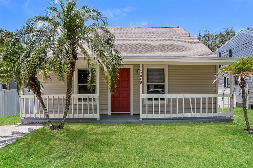 a view of a house with a yard