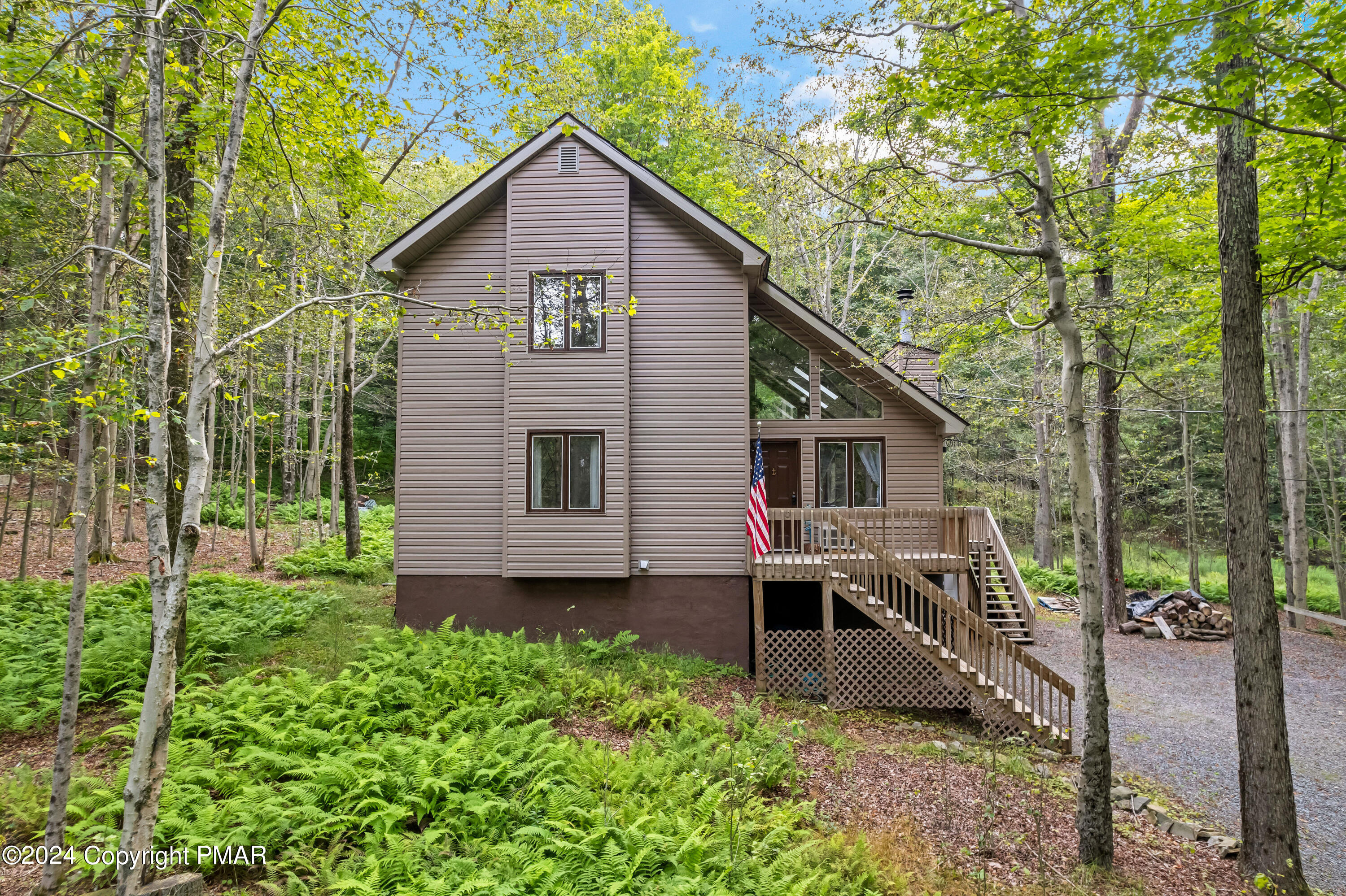 a view of a house in the forest