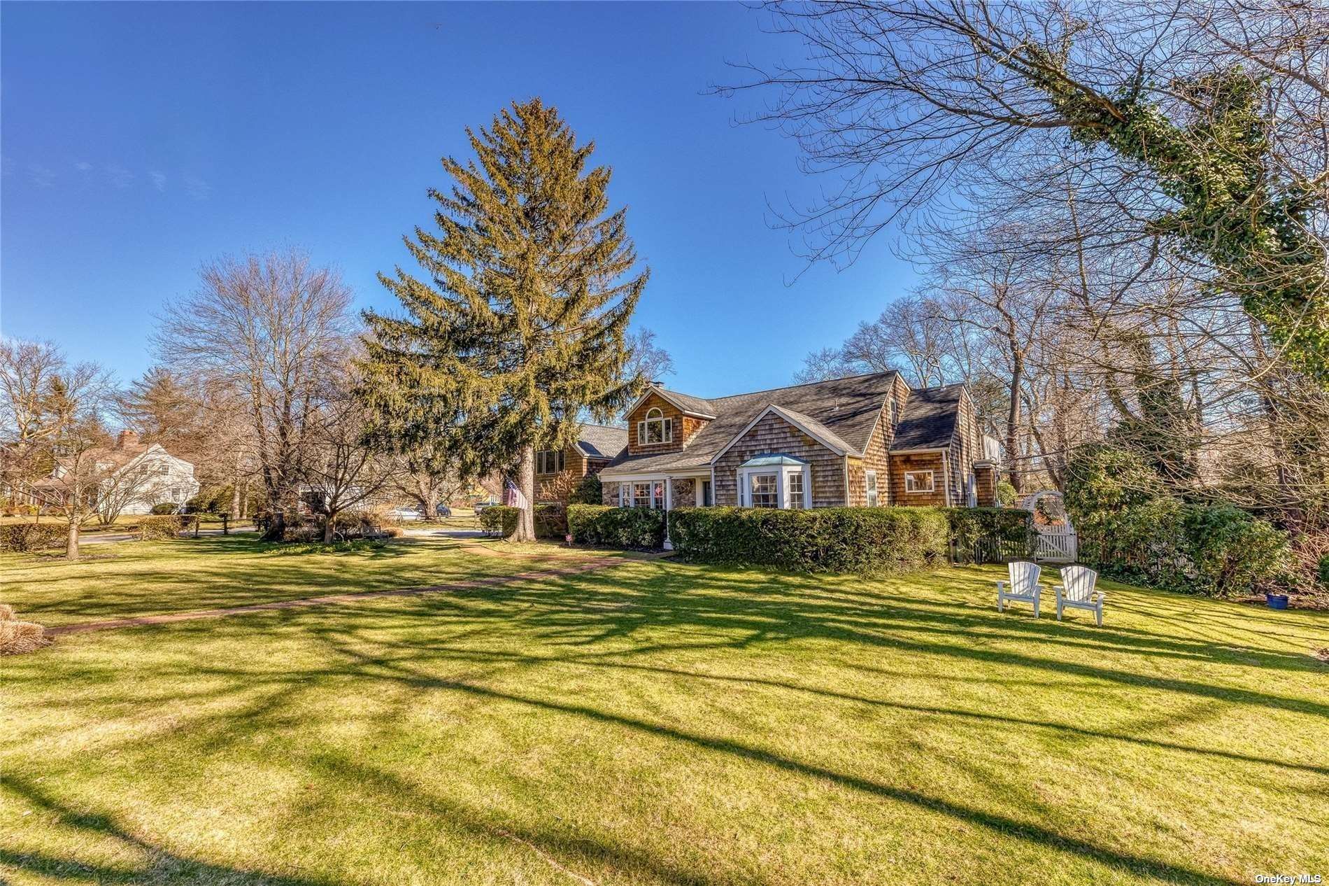 a front view of a house with a big yard