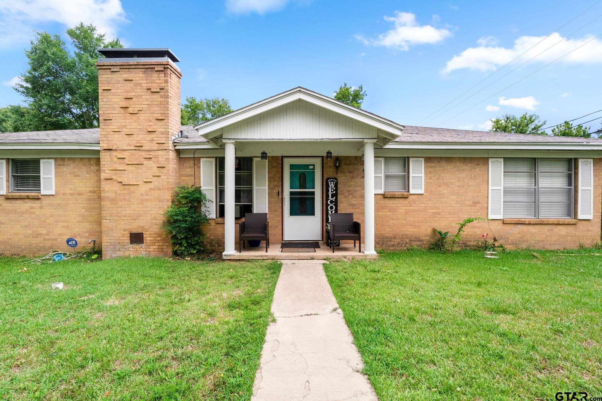 front view of a house with a yard