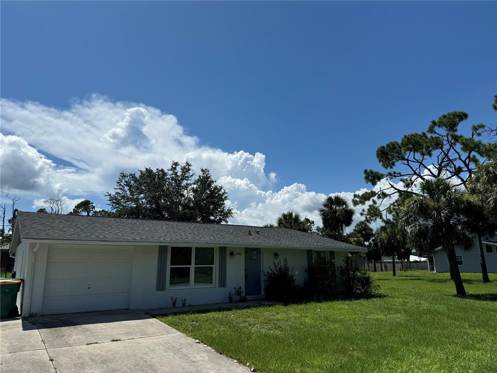 front view of a house with a garden