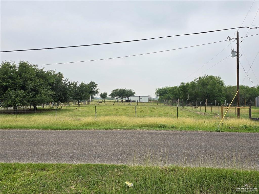 a view of a field and entertaining space