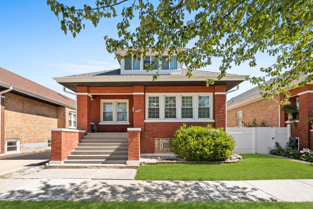 front view of a house with a yard