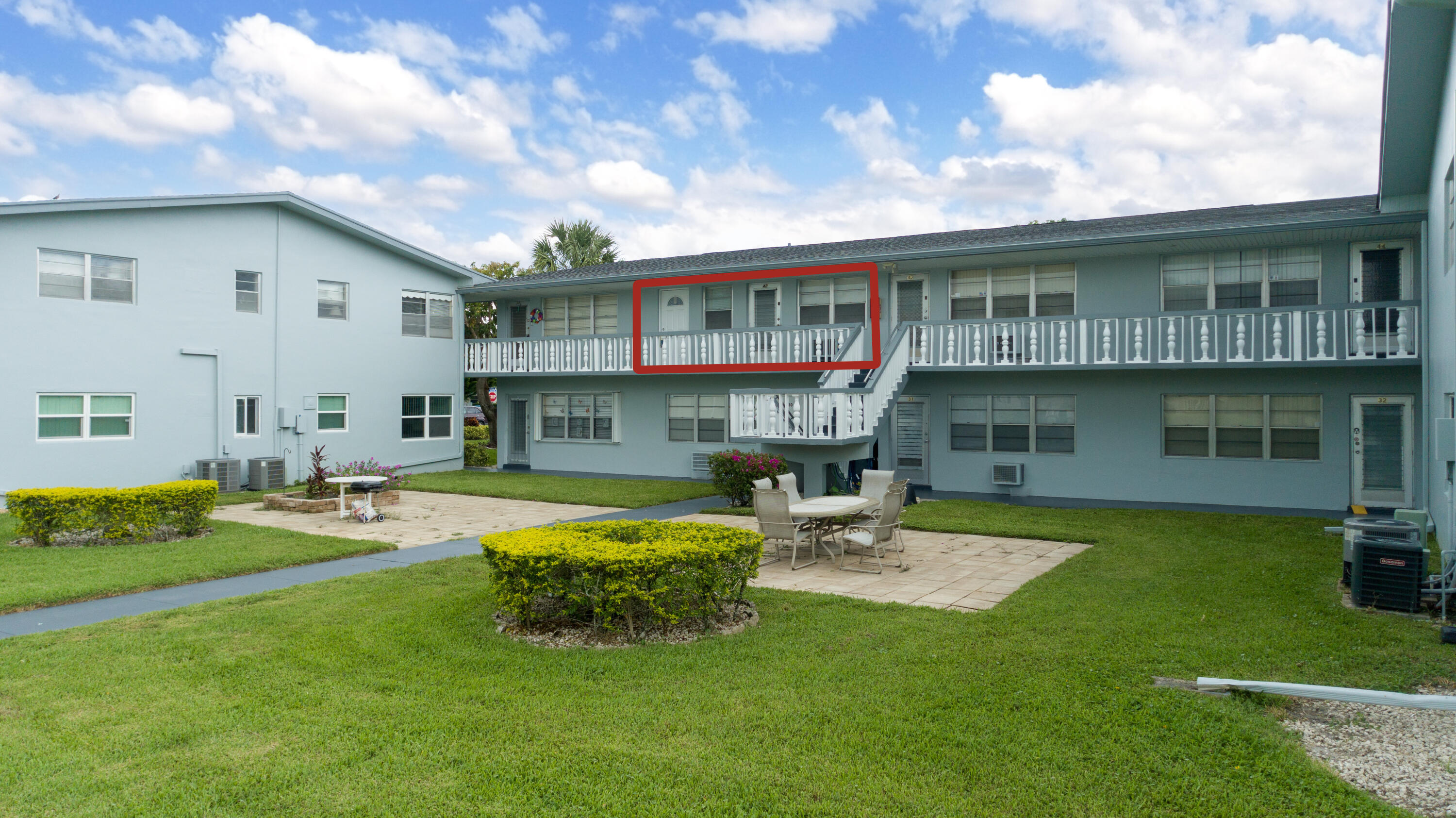 a view of a house with swimming pool and a yard