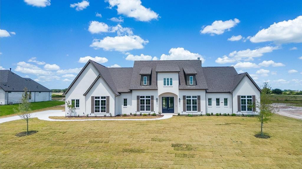 a front view of a house with swimming pool