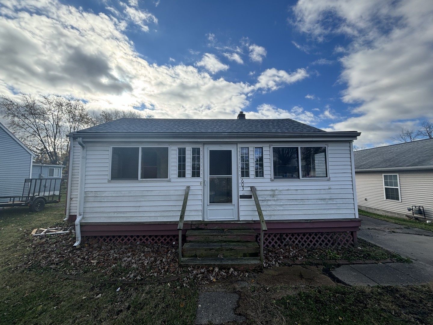 a front view of a house with yard