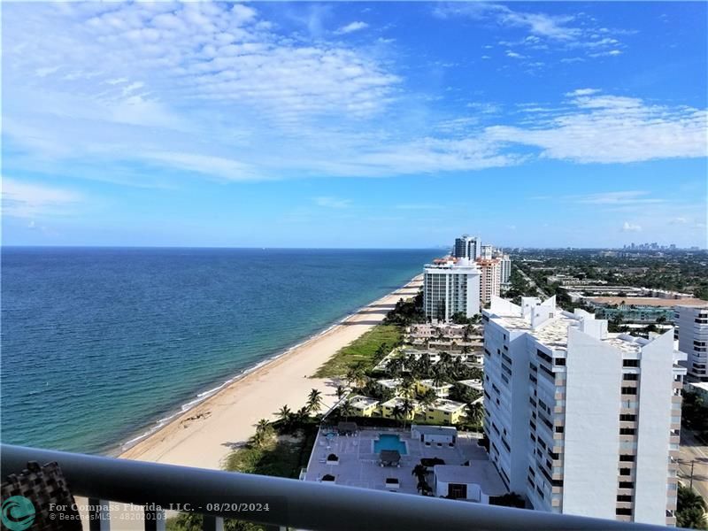 a view of a city and ocean