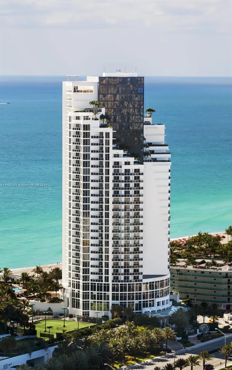 a view of ocean with a multi story building